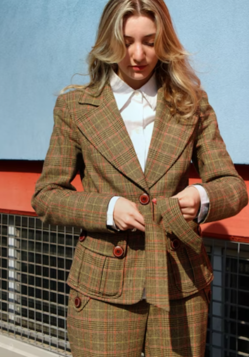 A ladies blazer made from a checkered fabric