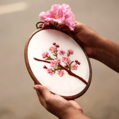 Embroider a branch with blossoms